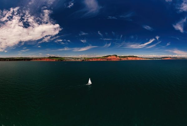 Abstract sea and boat graphic representing the journey of a video production project.